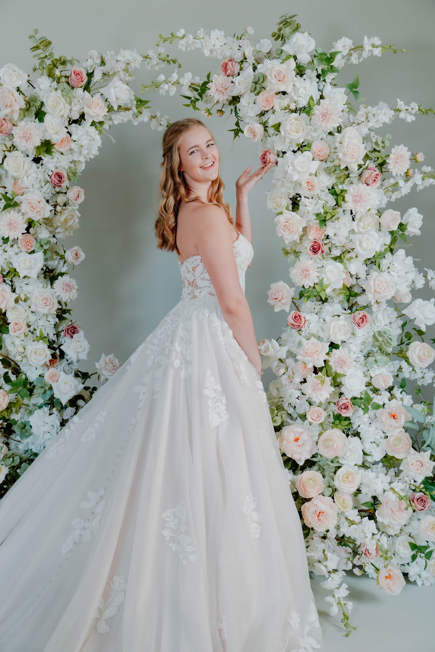 Beautiful Bride in front of Floral Wedding Arch Rental in Milwaukee Wisconsin